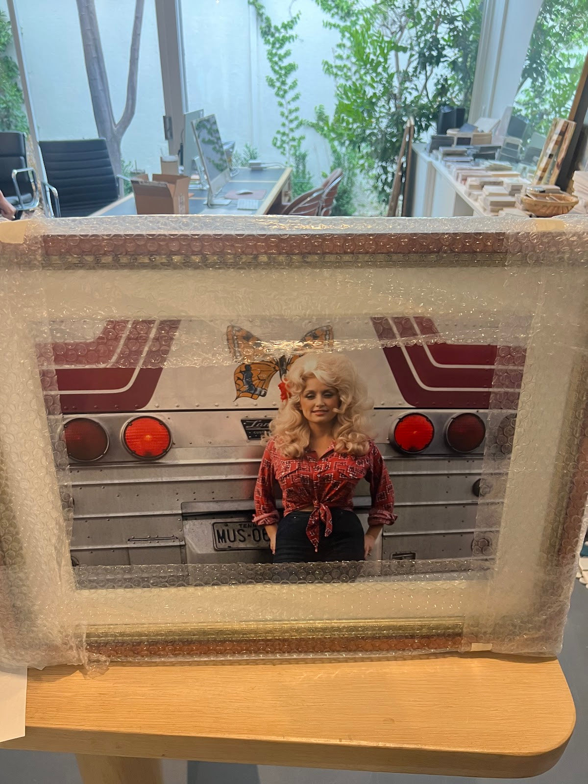 Dolly Behind Bus Framed Art